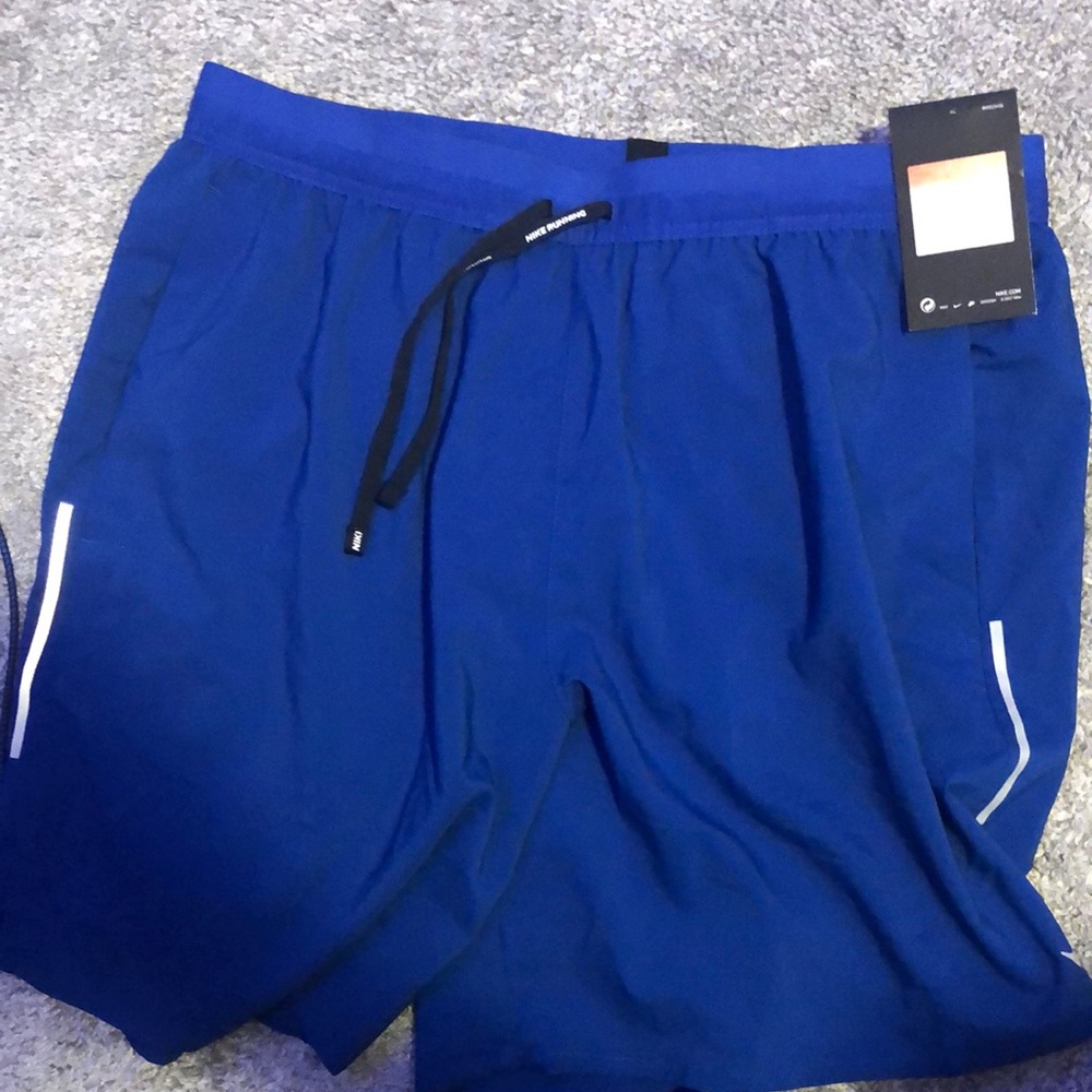 Blue Nike running shorts